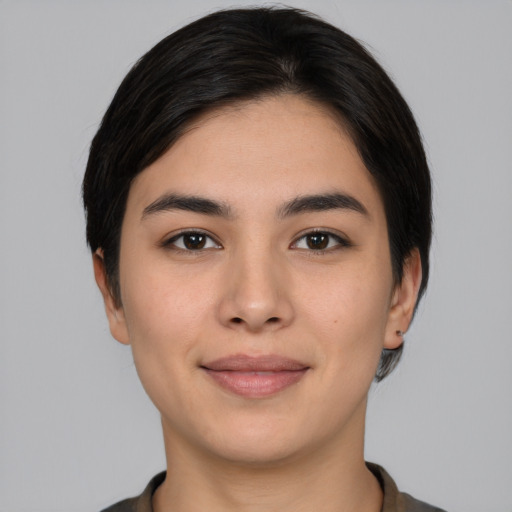 Joyful white young-adult female with short  black hair and brown eyes