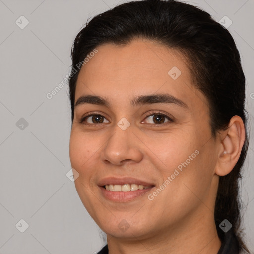 Joyful white young-adult female with long  brown hair and brown eyes