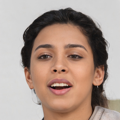 Joyful asian young-adult female with medium  brown hair and brown eyes