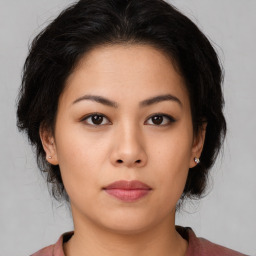 Neutral asian young-adult female with medium  brown hair and brown eyes