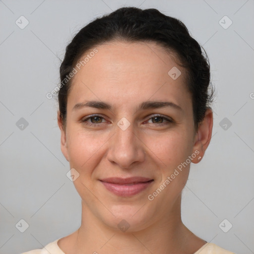 Joyful white young-adult female with short  brown hair and brown eyes