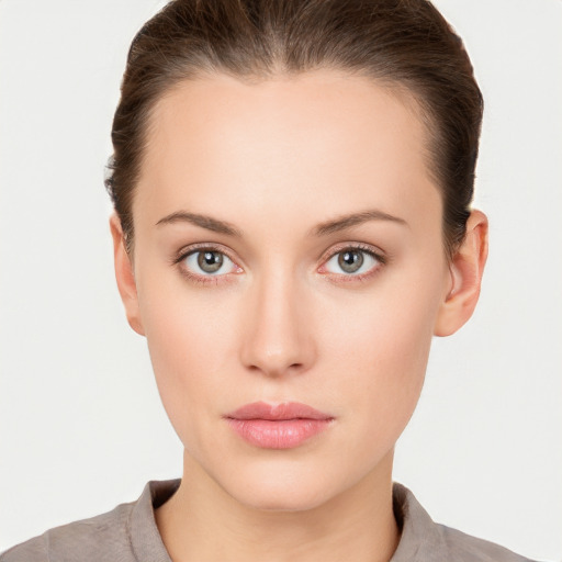 Neutral white young-adult female with short  brown hair and brown eyes