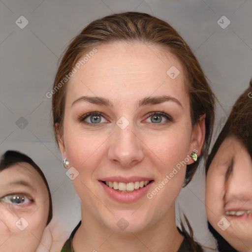 Joyful white young-adult female with medium  brown hair and green eyes