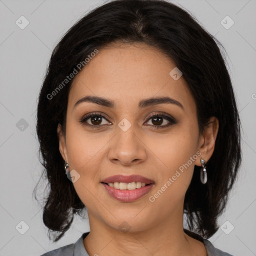 Joyful latino young-adult female with medium  brown hair and brown eyes