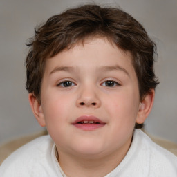 Joyful white child male with short  brown hair and brown eyes