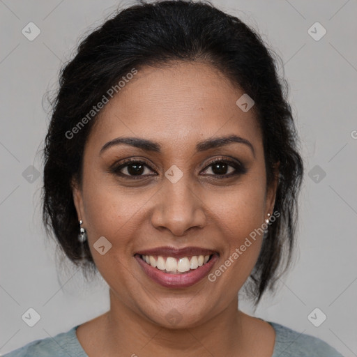 Joyful latino young-adult female with medium  brown hair and brown eyes