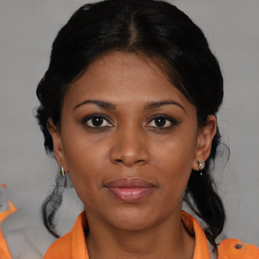 Joyful black young-adult female with short  brown hair and brown eyes
