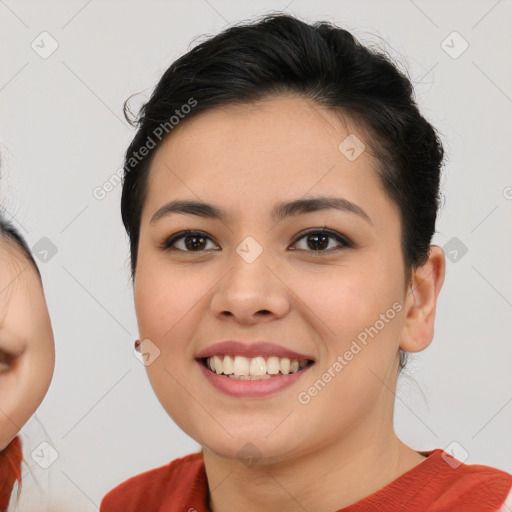 Joyful asian young-adult female with short  brown hair and brown eyes