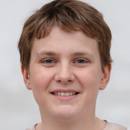 Joyful white child male with short  brown hair and brown eyes