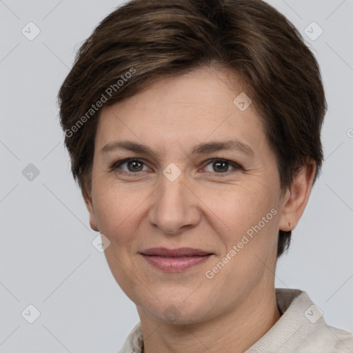 Joyful white adult female with short  brown hair and brown eyes