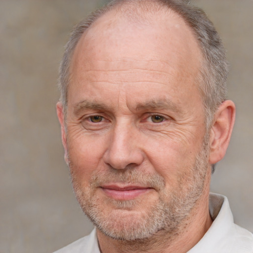 Joyful white middle-aged male with short  gray hair and brown eyes