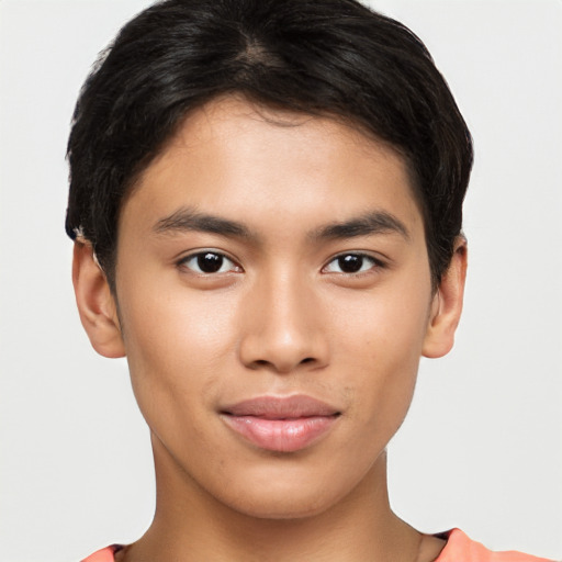 Joyful latino young-adult male with short  brown hair and brown eyes