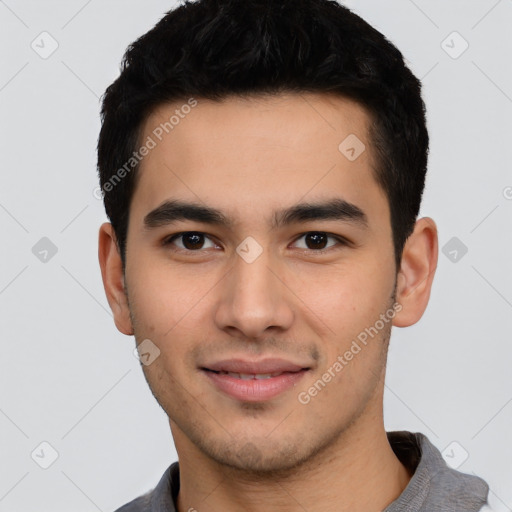 Joyful white young-adult male with short  black hair and brown eyes