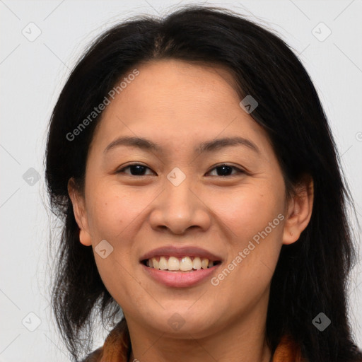 Joyful asian young-adult female with long  brown hair and brown eyes