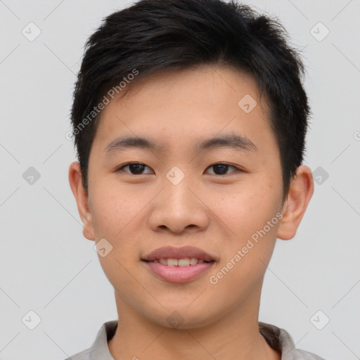 Joyful asian young-adult male with short  brown hair and brown eyes