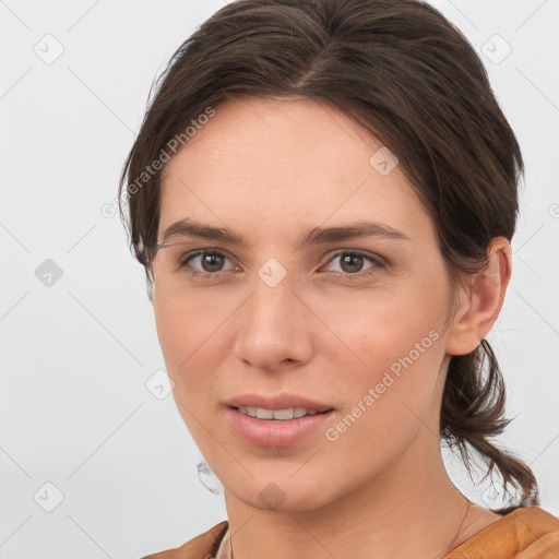 Joyful white young-adult female with medium  brown hair and grey eyes