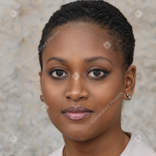 Joyful black young-adult female with short  brown hair and brown eyes