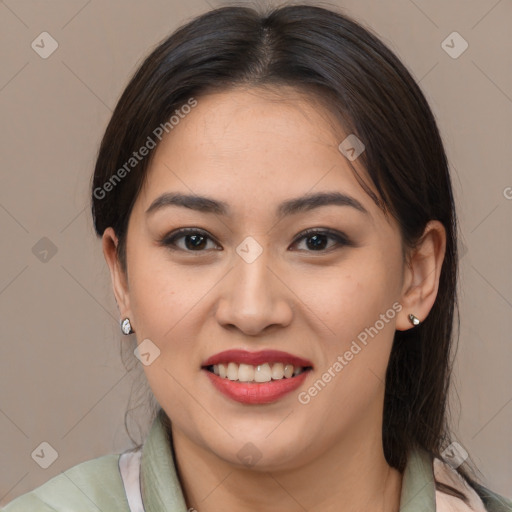 Joyful latino young-adult female with medium  brown hair and brown eyes