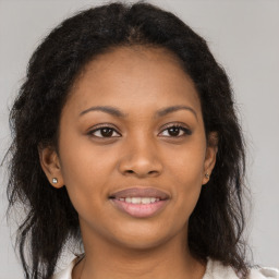 Joyful black young-adult female with medium  brown hair and brown eyes