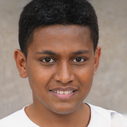 Joyful black young-adult male with short  brown hair and brown eyes