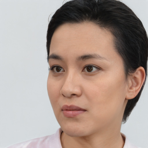 Joyful white young-adult female with medium  black hair and brown eyes