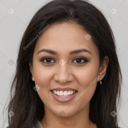 Joyful latino young-adult female with long  brown hair and brown eyes