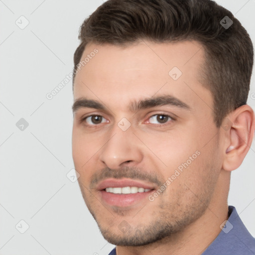 Joyful white young-adult male with short  brown hair and brown eyes