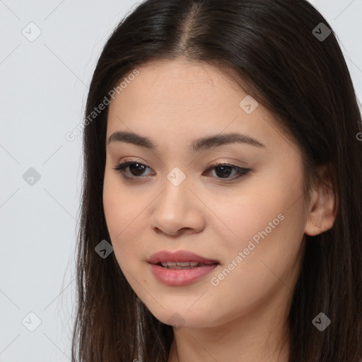 Joyful asian young-adult female with long  brown hair and brown eyes