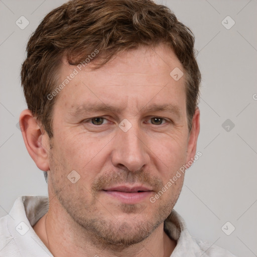 Joyful white adult male with short  brown hair and grey eyes