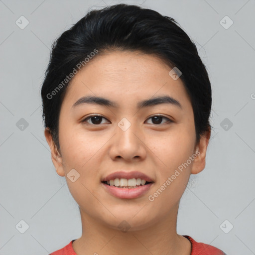 Joyful asian young-adult female with short  black hair and brown eyes