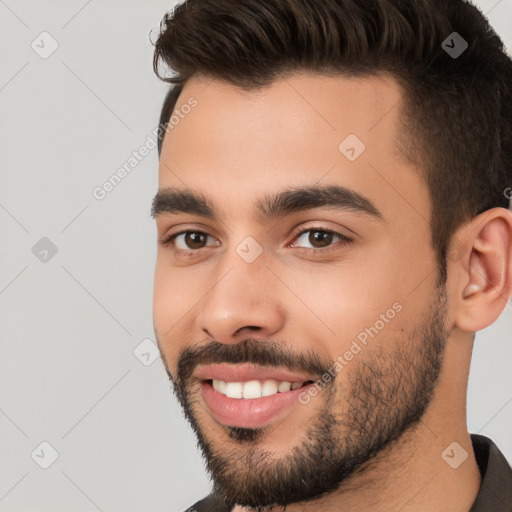 Joyful white young-adult male with short  black hair and brown eyes