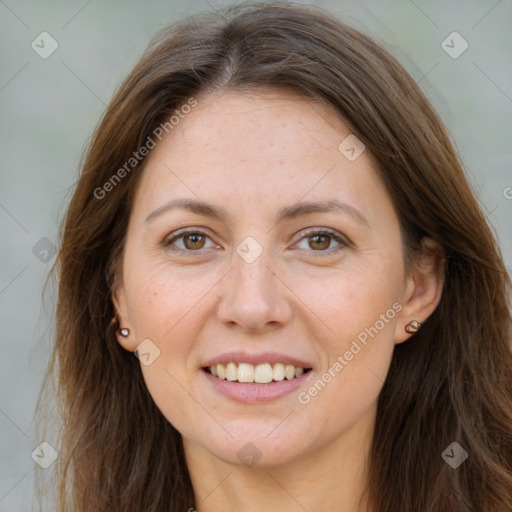 Joyful white adult female with long  brown hair and brown eyes