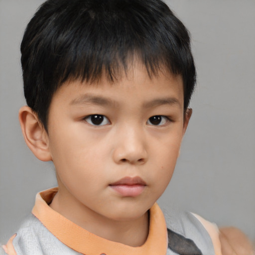 Neutral asian child male with short  brown hair and brown eyes