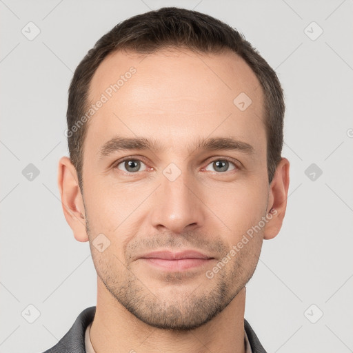 Joyful white young-adult male with short  brown hair and brown eyes