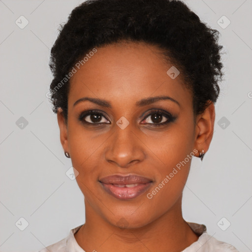 Joyful black young-adult female with short  black hair and brown eyes