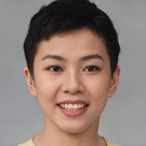 Joyful asian young-adult female with short  brown hair and brown eyes