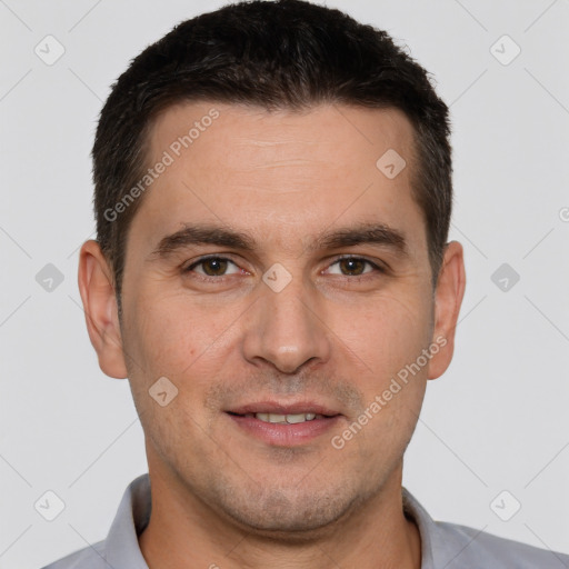 Joyful white adult male with short  brown hair and brown eyes