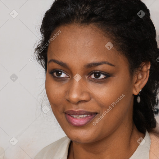 Joyful black young-adult female with medium  brown hair and brown eyes