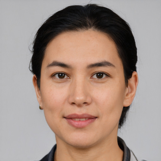 Joyful white young-adult female with medium  black hair and brown eyes