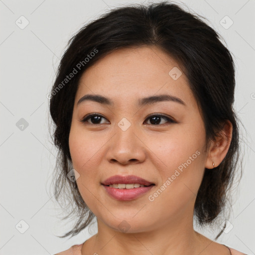 Joyful asian young-adult female with medium  brown hair and brown eyes