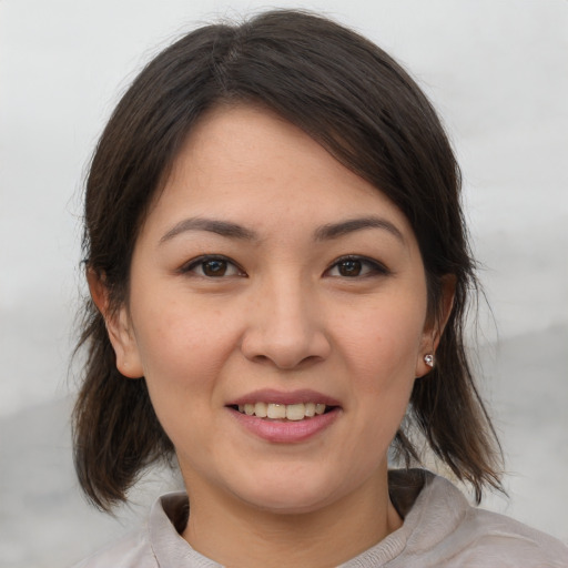 Joyful white young-adult female with medium  brown hair and brown eyes