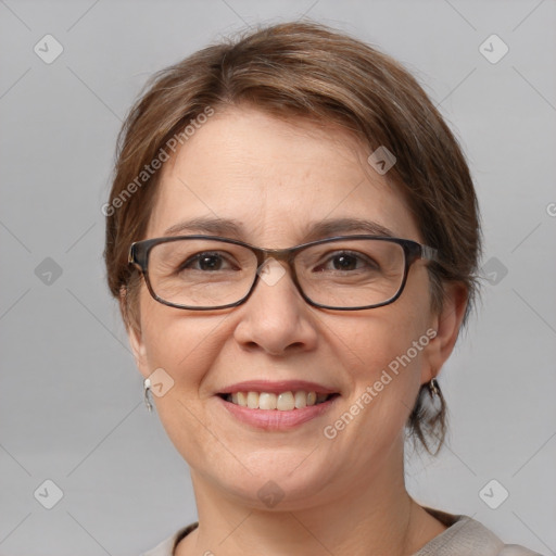 Joyful white adult female with medium  brown hair and blue eyes