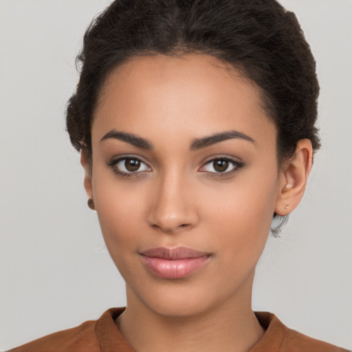 Joyful latino young-adult female with short  brown hair and brown eyes