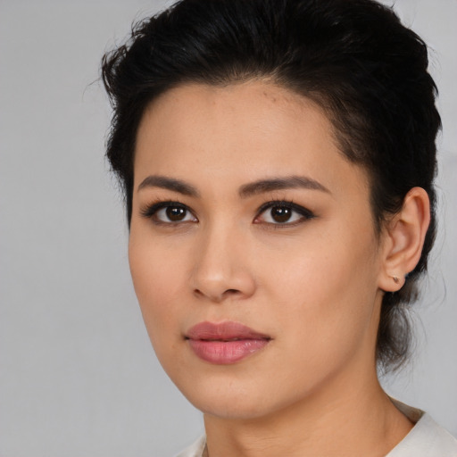 Neutral latino young-adult female with medium  brown hair and brown eyes