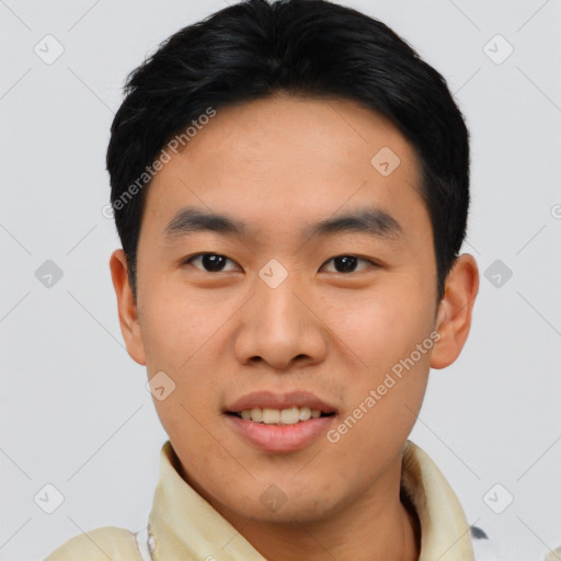 Joyful asian young-adult male with short  black hair and brown eyes