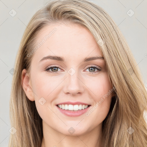 Joyful white young-adult female with long  brown hair and blue eyes