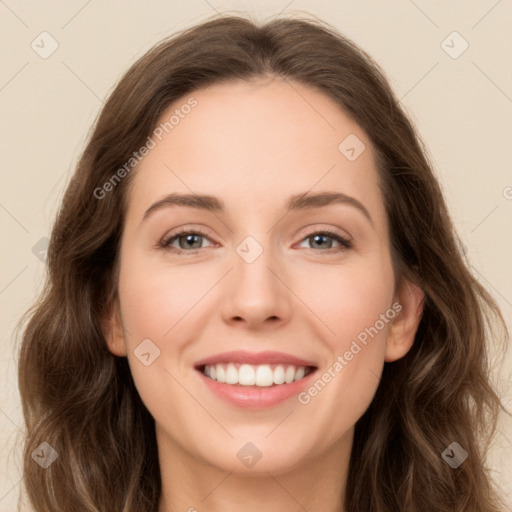 Joyful white young-adult female with long  brown hair and green eyes