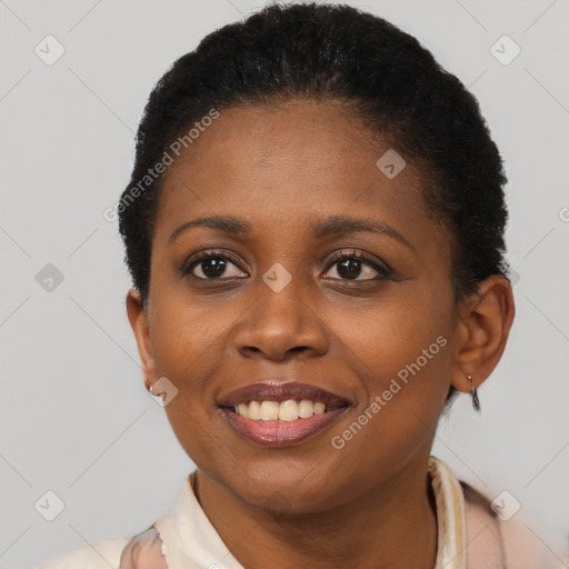 Joyful black young-adult female with short  brown hair and brown eyes