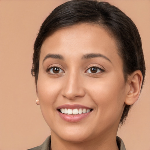 Joyful white young-adult female with medium  brown hair and brown eyes