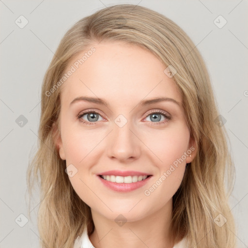 Joyful white young-adult female with long  brown hair and blue eyes